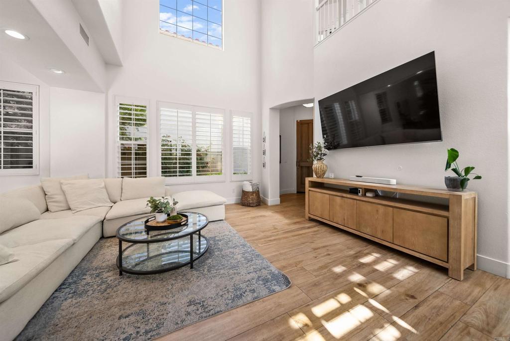 7100 Surfbird Circle Carlsbad, CA 92011 - Photo 5 of 65 a living room with furniture and a flat screen tv