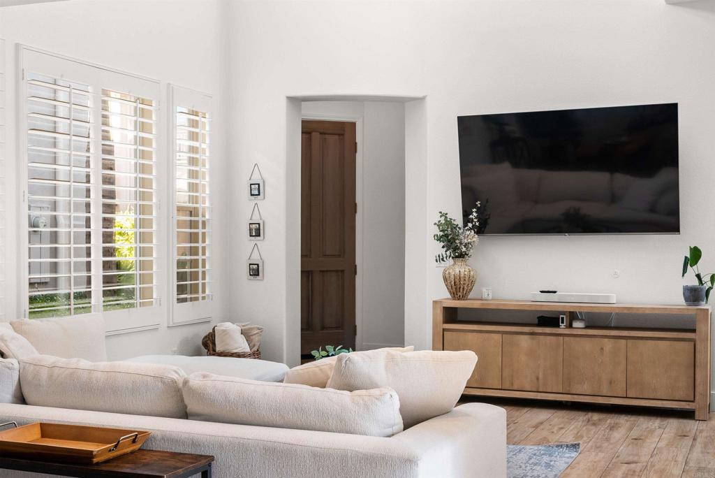 7100 Surfbird Circle Carlsbad, CA 92011 - Photo 6 of 65 a living room with furniture and a flat screen tv