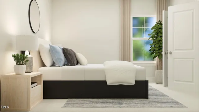 a bedroom with a bed and a potted plant next to a window
