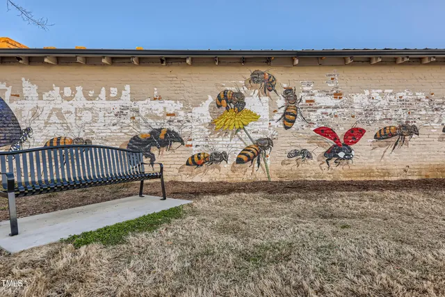 a view of a swimming pool with a patio and a yard