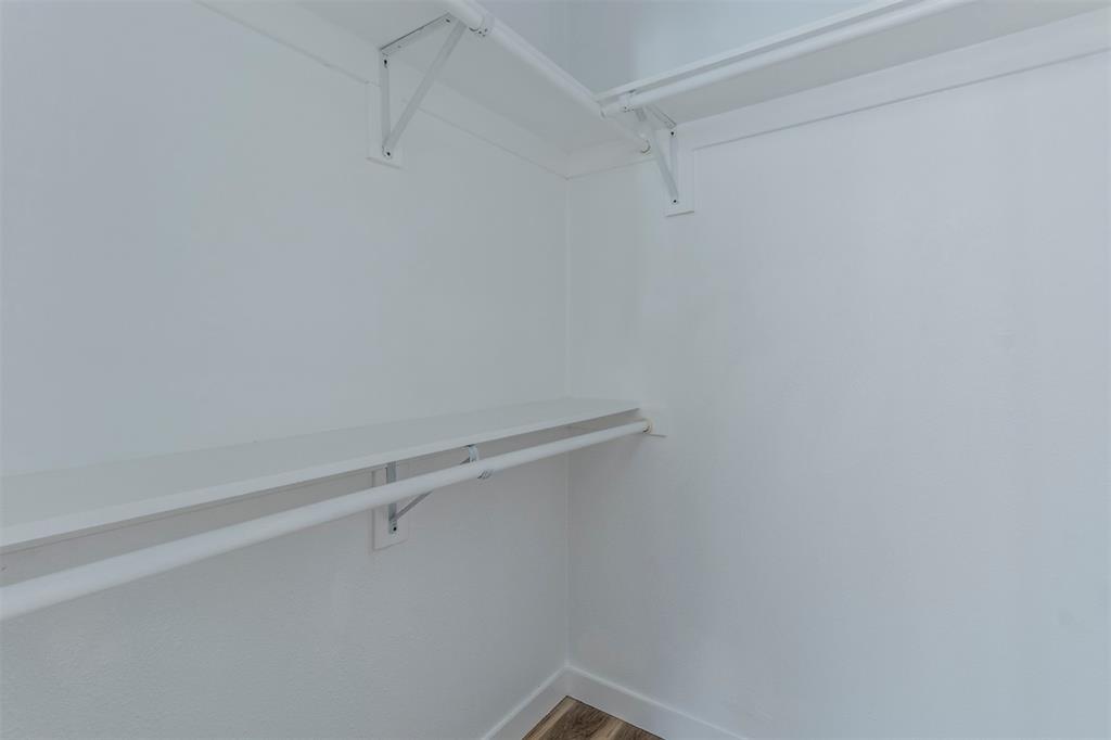 1014 Trinity Street Cleburne, TX 76031 - Photo 23 of 34 Walk in closet featuring wood finished floors