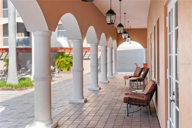 swimming pool view with a seating space