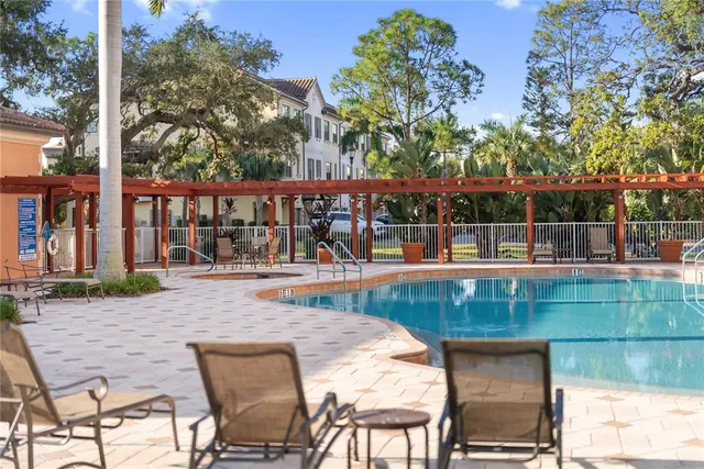 a view of a swimming pool with a patio