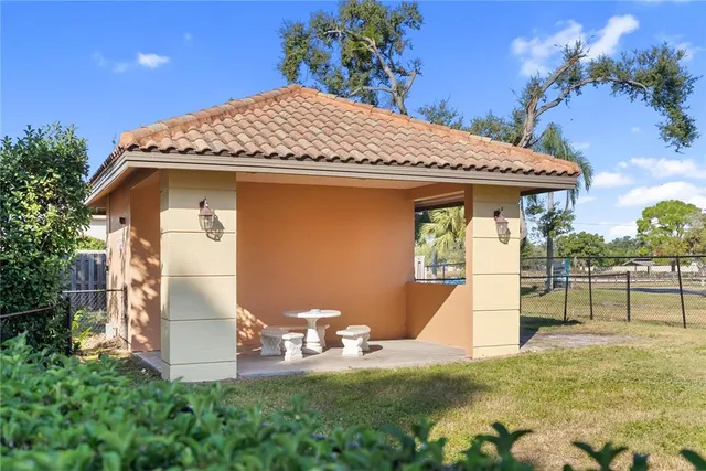 a living room with furniture dining table and a large window