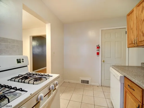 a kitchen with a stove and a sink