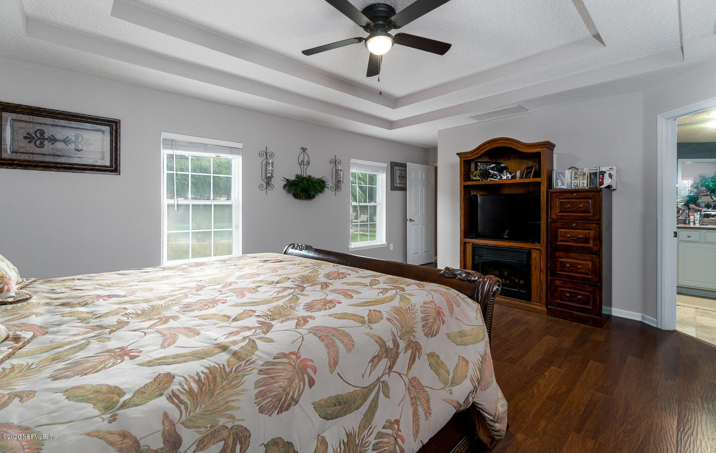 8145 Wendover Road St. Augustine, FL 32092 - Photo 11 of 55 a bedroom with a bed and a flat screen tv