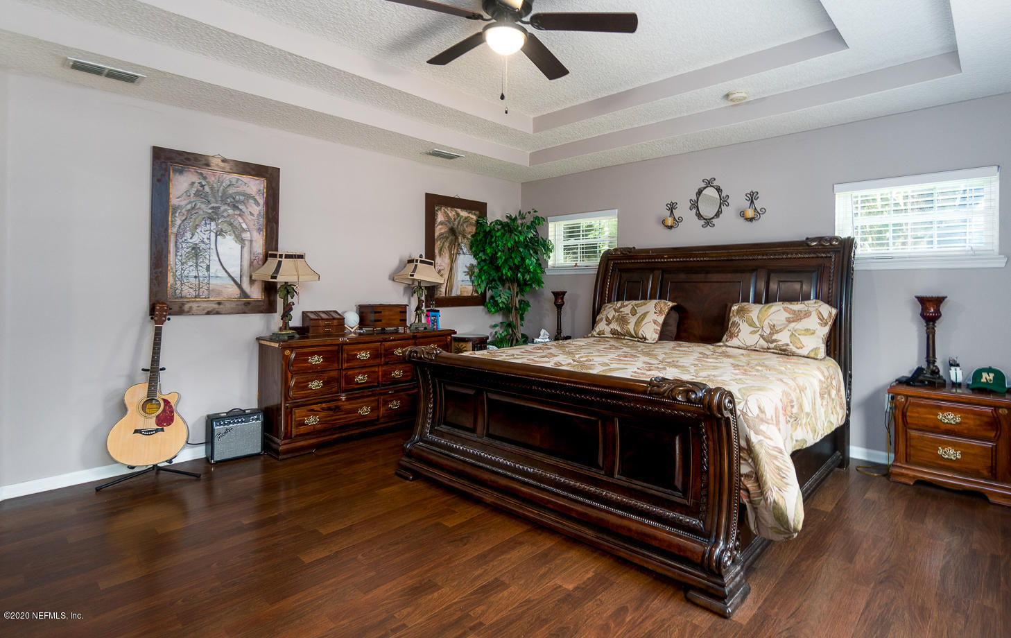8145 Wendover Road St. Augustine, FL 32092 - Photo 12 of 55 a bed room with a bed and a chandelier