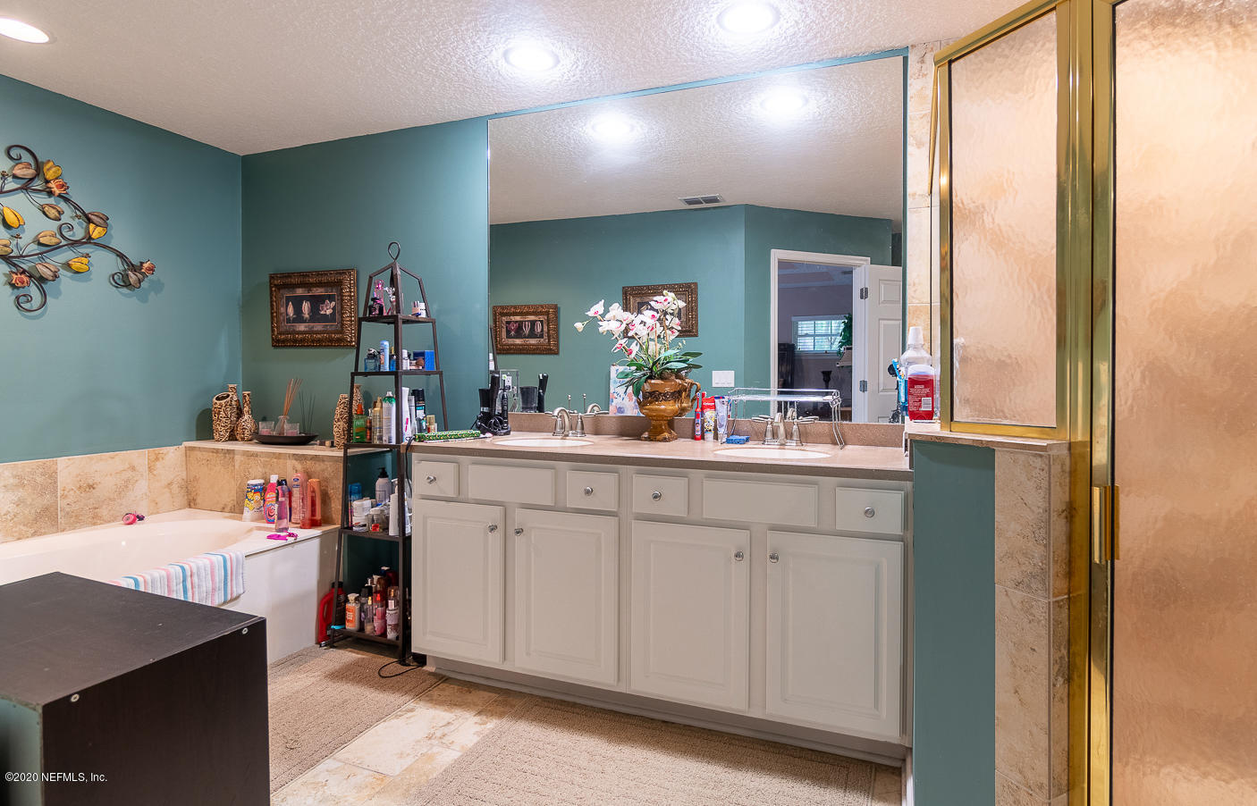 8145 Wendover Road St. Augustine, FL 32092 - Photo 13 of 55 a bathroom with a sink vanity and a mirror