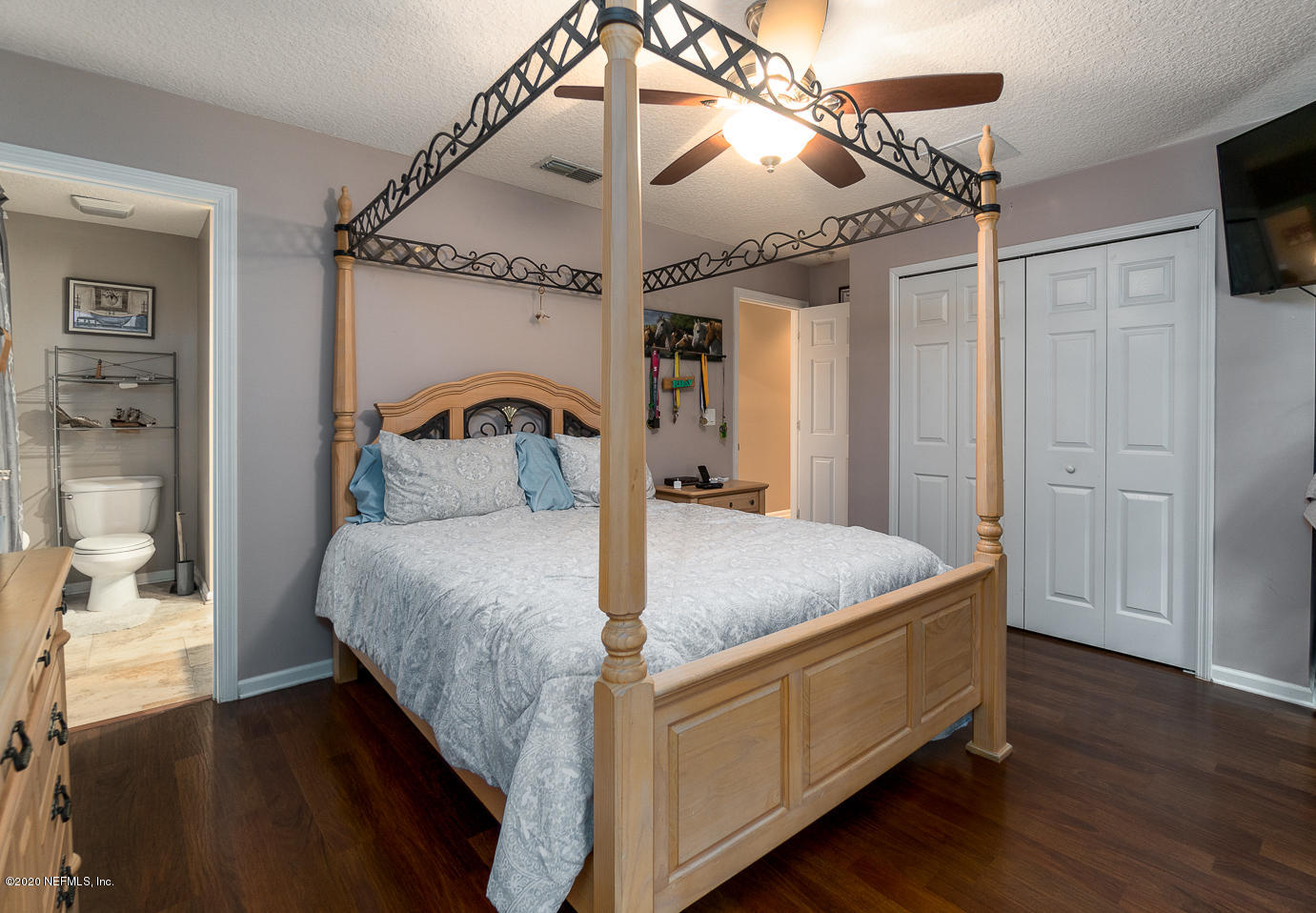 8145 Wendover Road St. Augustine, FL 32092 - Photo 16 of 55 a bed room with a bed and a mirror