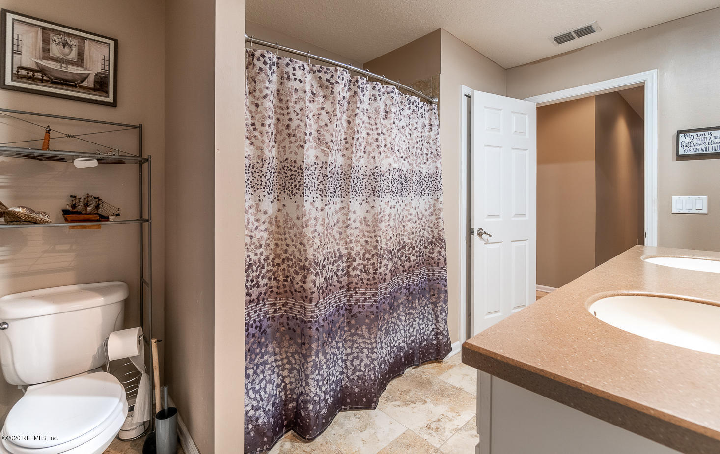 8145 Wendover Road St. Augustine, FL 32092 - Photo 17 of 55 a bathroom with a granite countertop sink toilet and shower