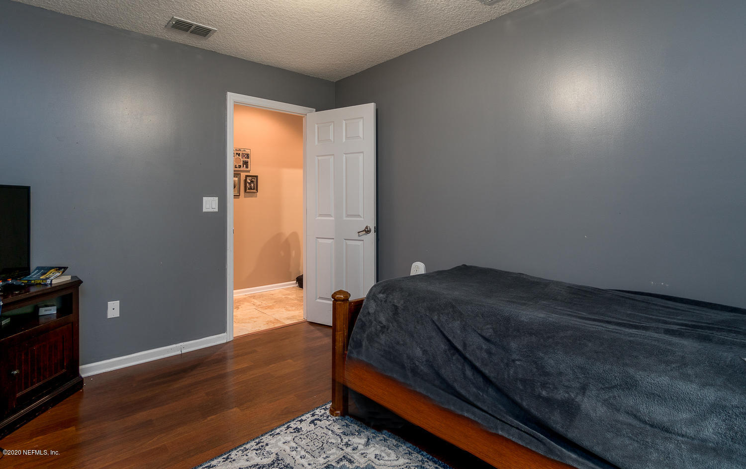 8145 Wendover Road St. Augustine, FL 32092 - Photo 22 of 55 a bedroom with a bed and a window
