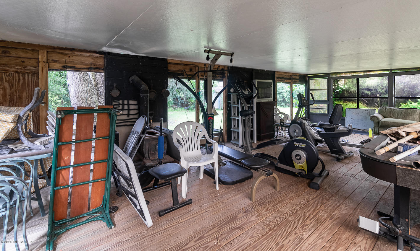 8145 Wendover Road St. Augustine, FL 32092 - Photo 23 of 55 a room with lots of chairs and a large window