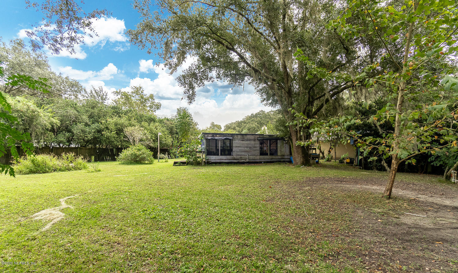 8145 Wendover Road St. Augustine, FL 32092 - Photo 24 of 55 a house with trees in front of it