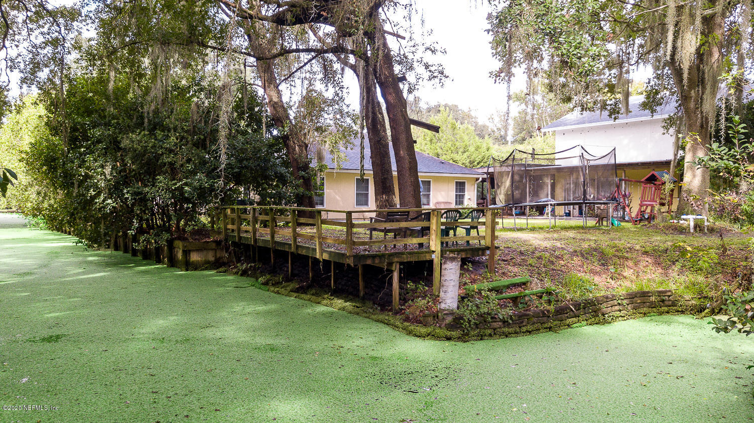 8145 Wendover Road St. Augustine, FL 32092 - Photo 30 of 55 a swimming pool with outdoor seating and yard