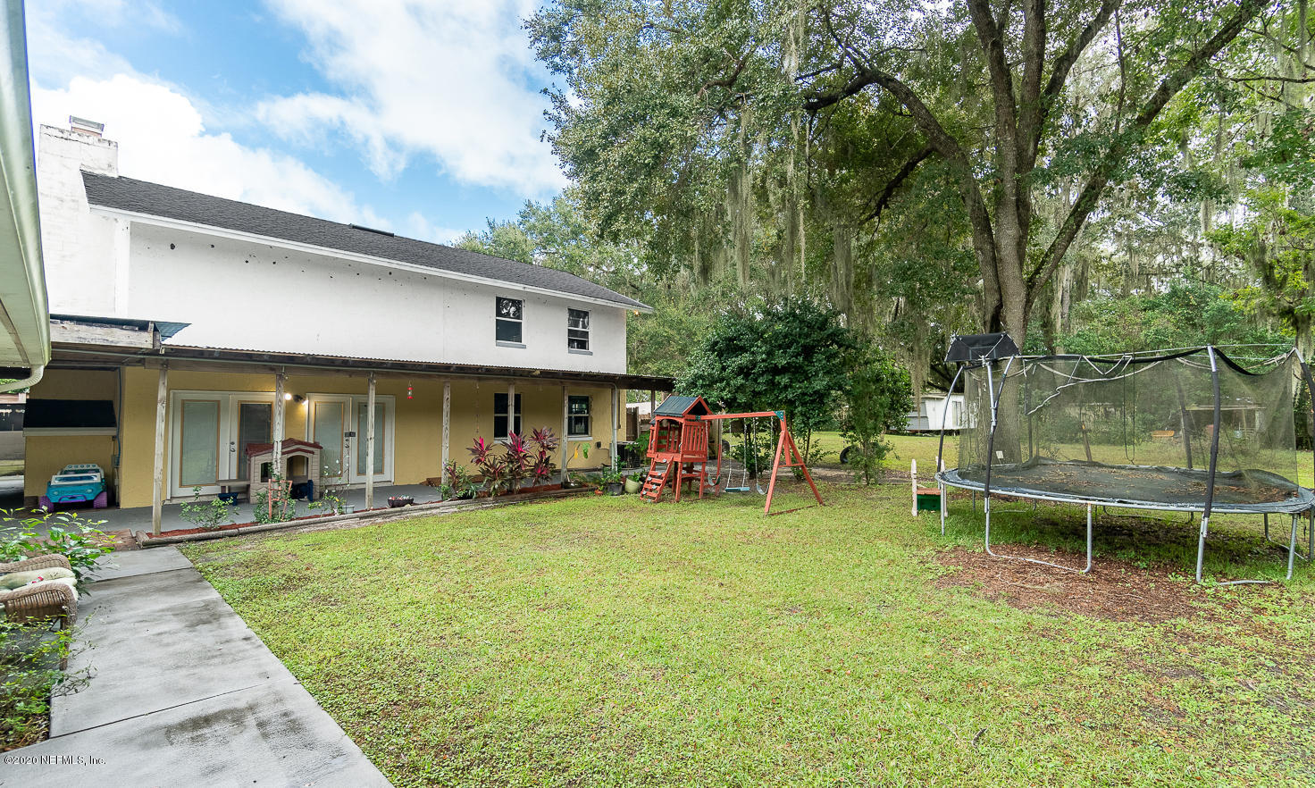 8145 Wendover Road St. Augustine, FL 32092 - Photo 31 of 55 a view of a chairs and tables in the patio and a fountain in the patio