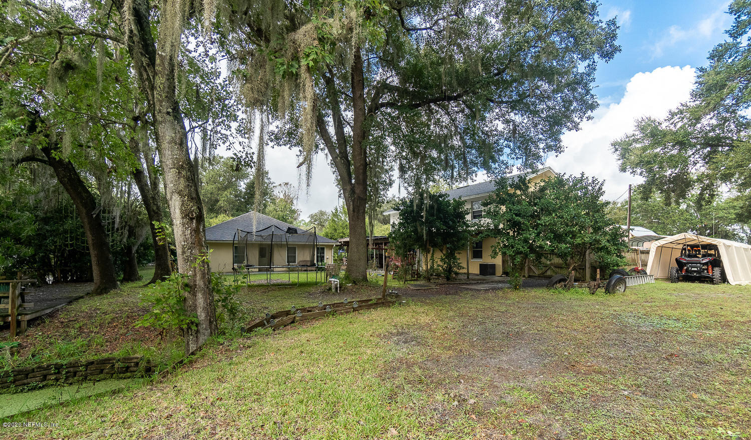 8145 Wendover Road St. Augustine, FL 32092 - Photo 32 of 55 a view of a house with a yard and trees