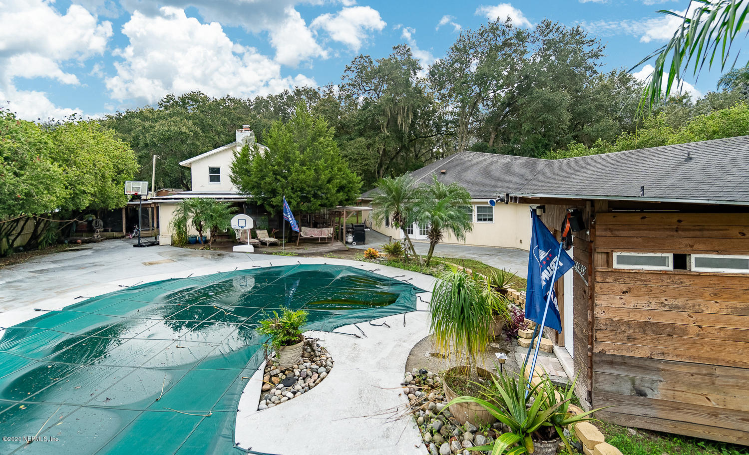 8145 Wendover Road St. Augustine, FL 32092 - Photo 36 of 55 a view of a house with a yard and sitting area