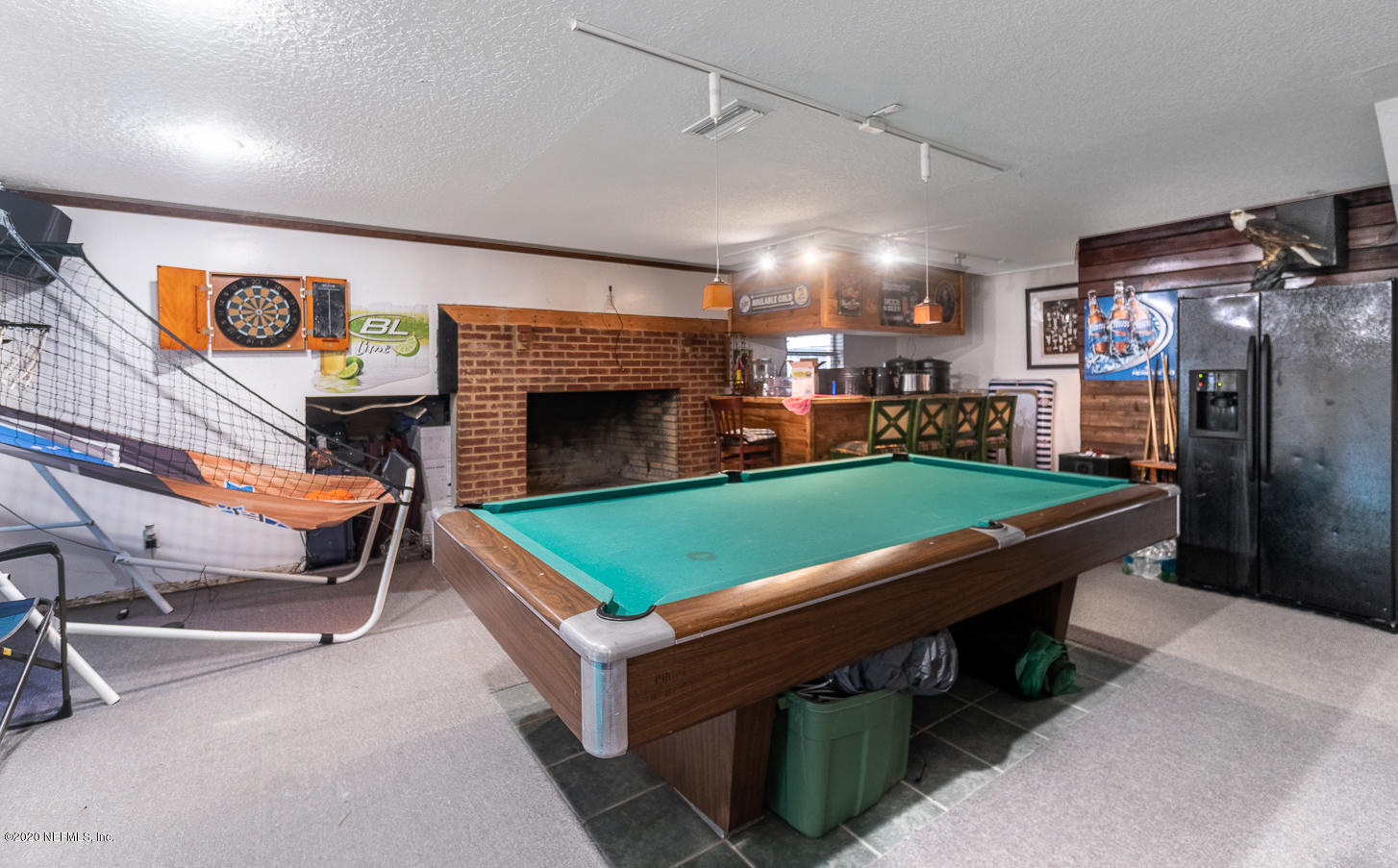 8145 Wendover Road St. Augustine, FL 32092 - Photo 40 of 55 a room with pool table table and chairs