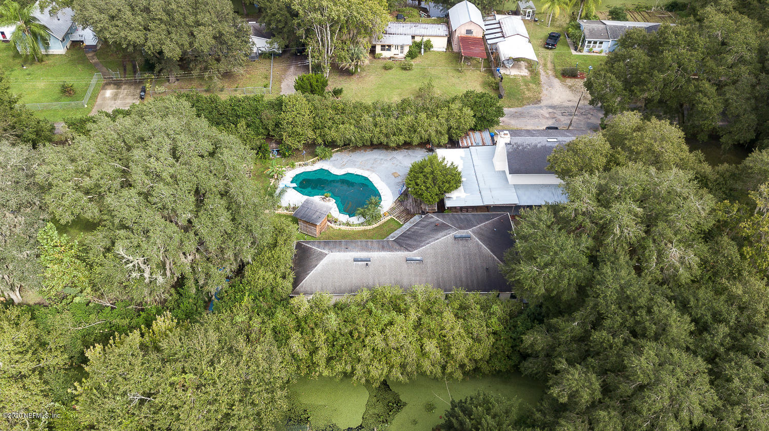 8145 Wendover Road St. Augustine, FL 32092 - Photo 4 of 55 an aerial view of a house with a yard and lake view