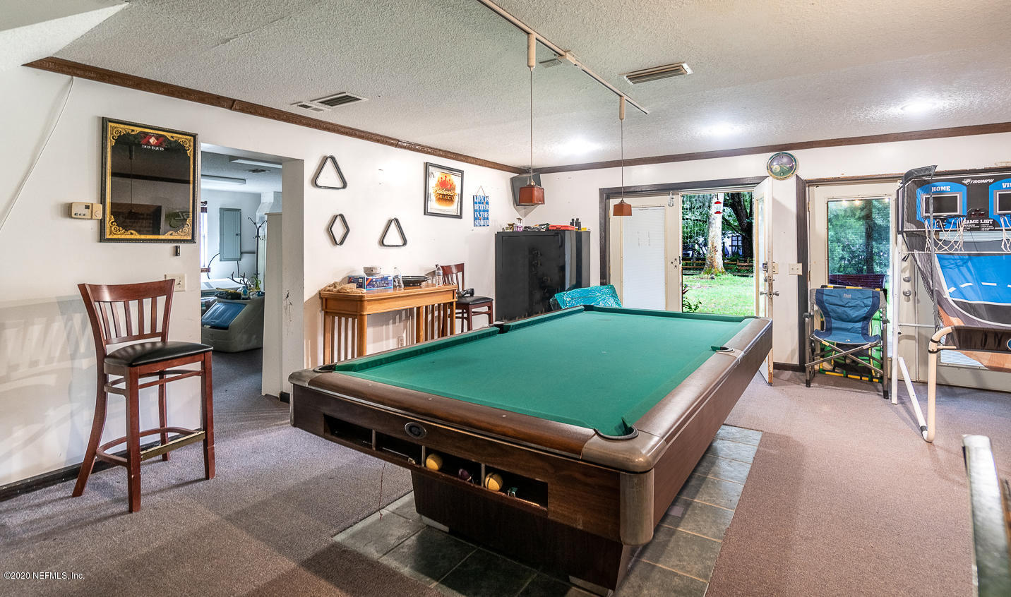 8145 Wendover Road St. Augustine, FL 32092 - Photo 41 of 55 a room with furniture and a flat screen tv