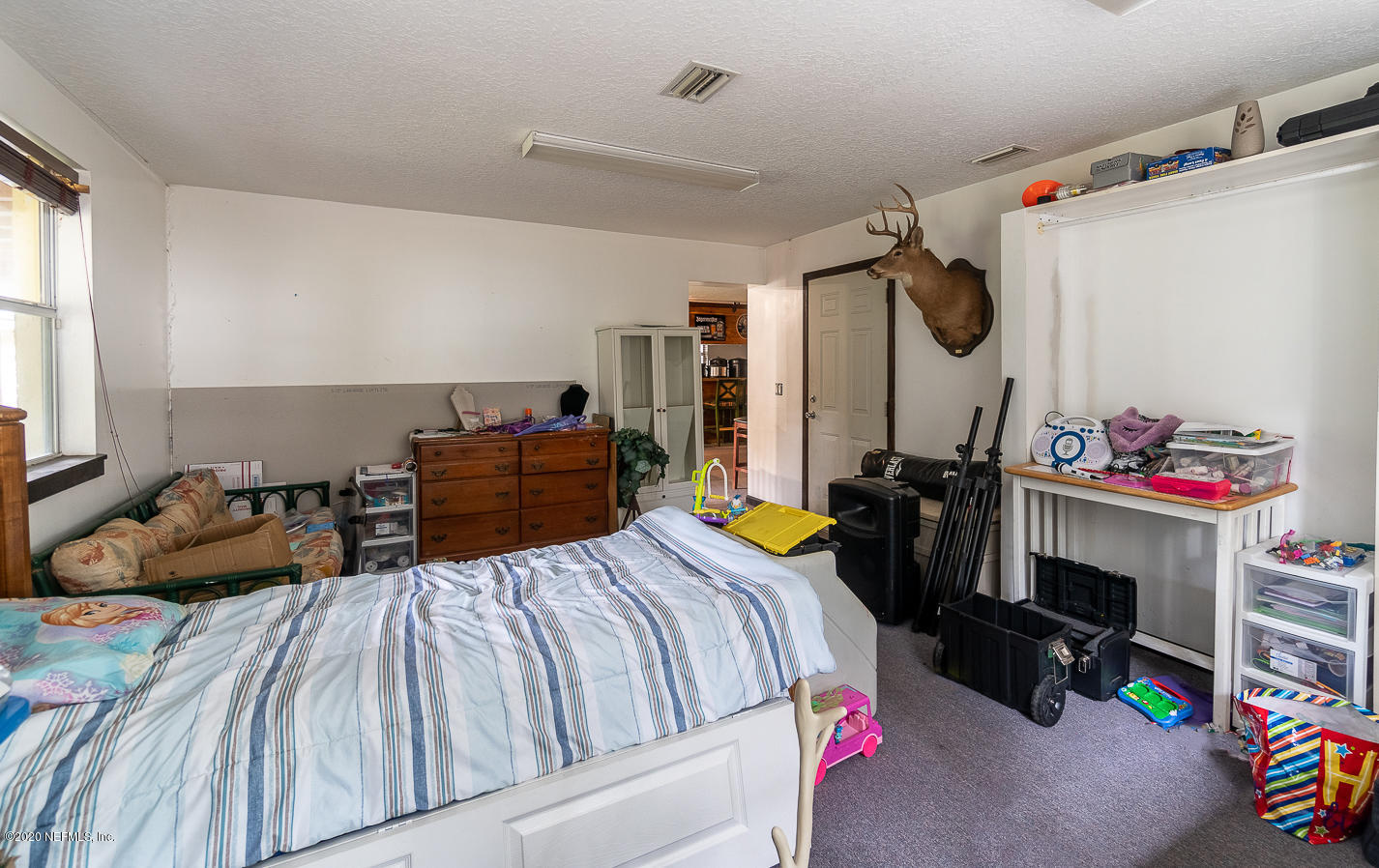 8145 Wendover Road St. Augustine, FL 32092 - Photo 43 of 55 a bedroom with bed and a window