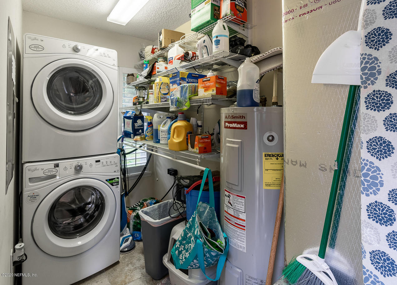 8145 Wendover Road St. Augustine, FL 32092 - Photo 46 of 55 a utility room with dryer and washer