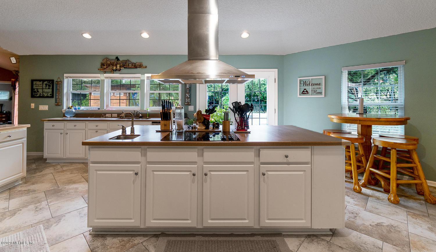 8145 Wendover Road St. Augustine, FL 32092 - Photo 8 of 55 a kitchen with stainless steel appliances granite countertop a sink and a large window