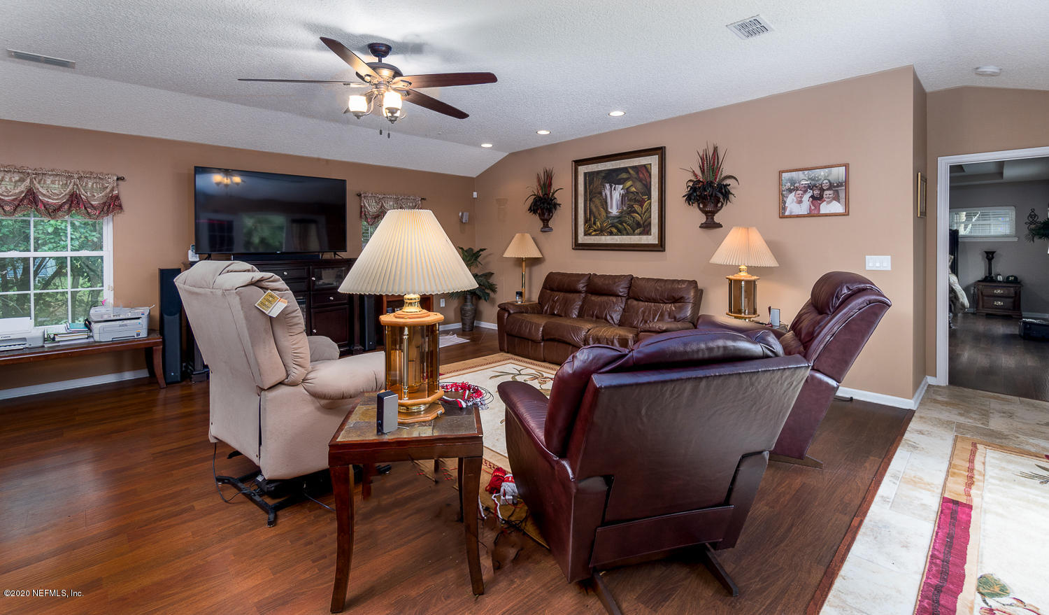 8145 Wendover Road St. Augustine, FL 32092 - Photo 10 of 55 a living room with furniture and a chandelier