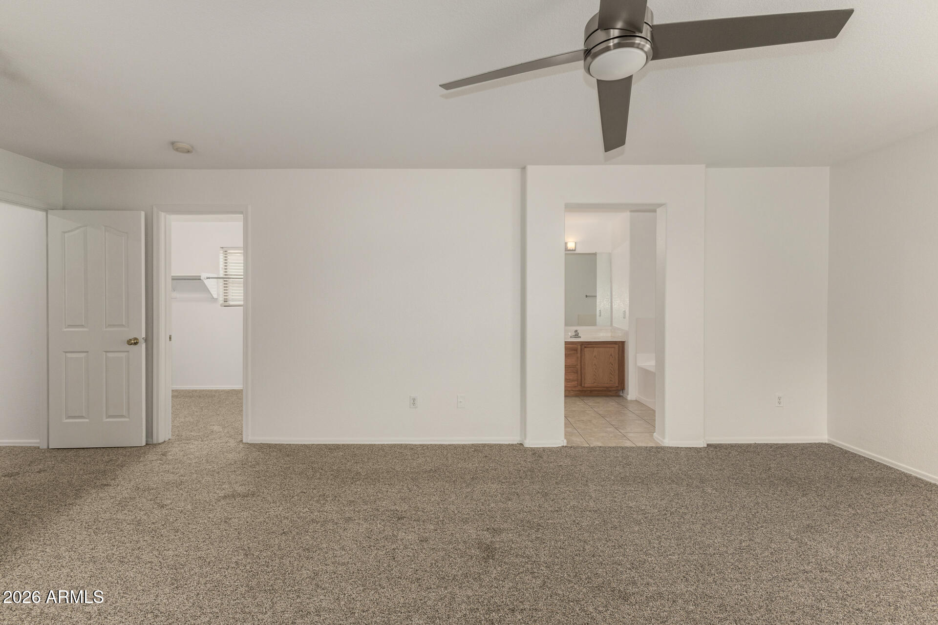 3832 East Jasper Drive Gilbert, AZ 85296 - Photo 16 of 43 a view of a big room with closet and chandelier fan