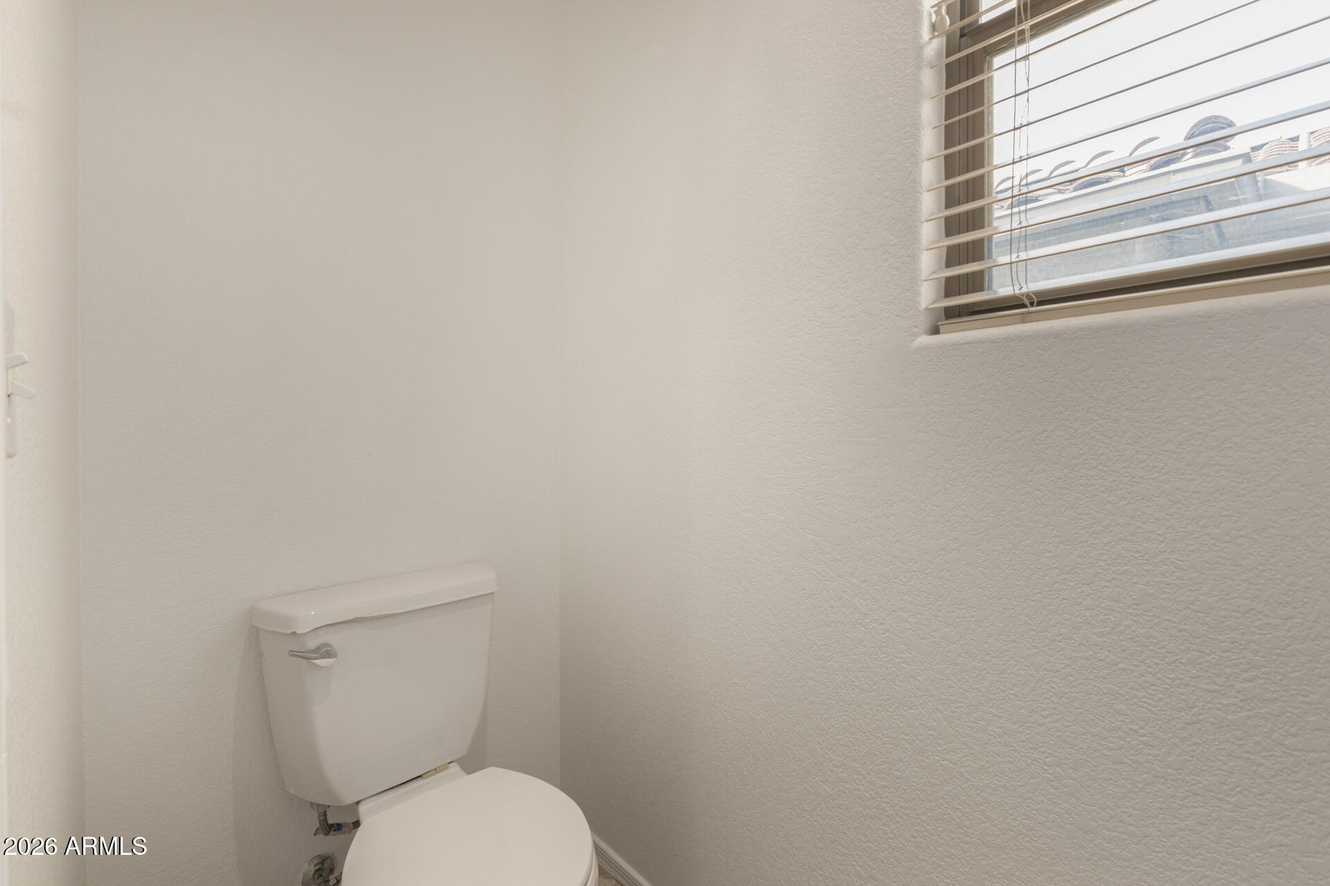 3832 East Jasper Drive Gilbert, AZ 85296 - Photo 21 of 43 a white toilet sitting next to a window