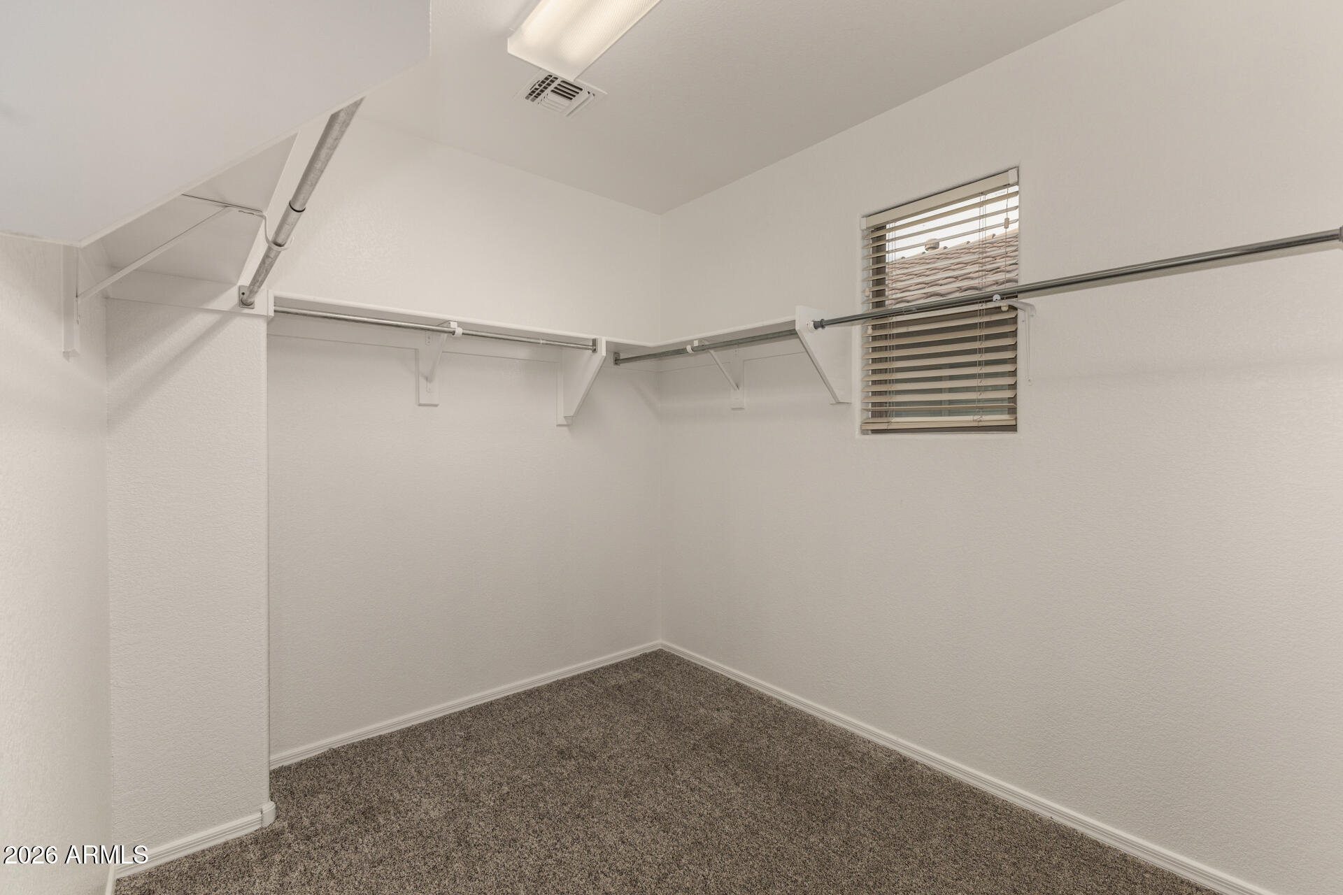 3832 East Jasper Drive Gilbert, AZ 85296 - Photo 22 of 43 a view of a room with racks on the wall