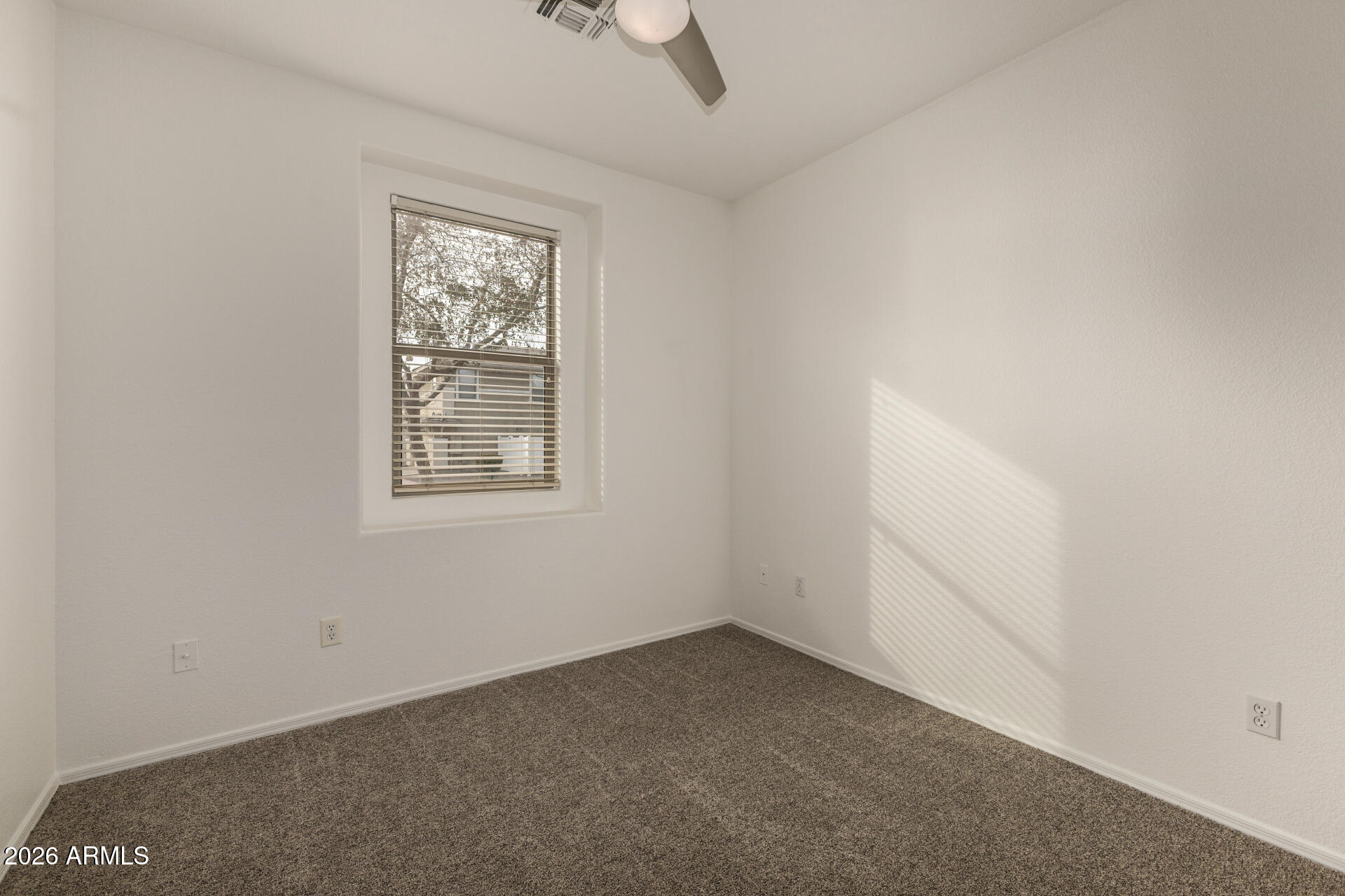 3832 East Jasper Drive Gilbert, AZ 85296 - Photo 23 of 43 an empty room with windows