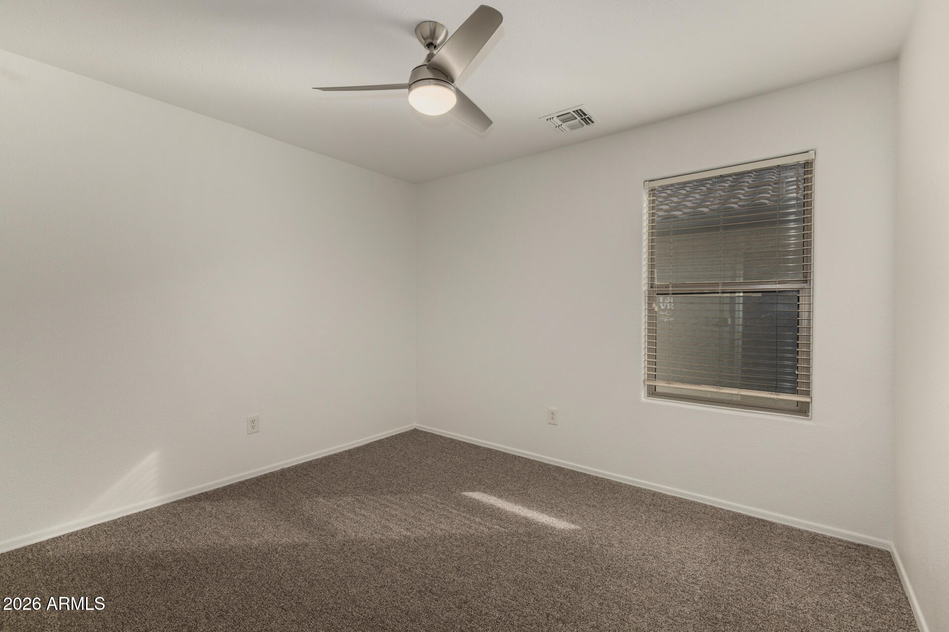 3832 East Jasper Drive Gilbert, AZ 85296 - Photo 27 of 43 an empty room with a window
