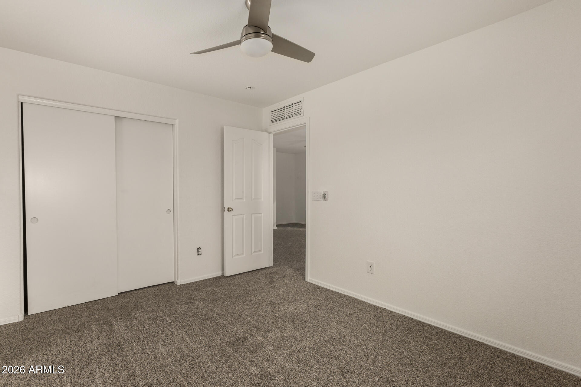3832 East Jasper Drive Gilbert, AZ 85296 - Photo 29 of 43 an empty room with a ceiling fan