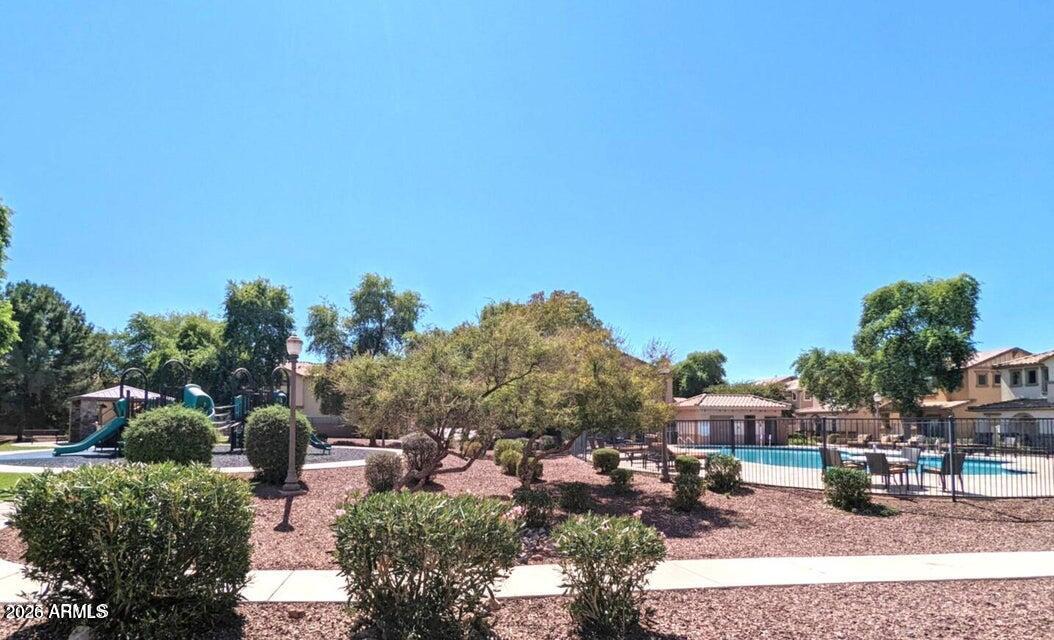 3832 East Jasper Drive Gilbert, AZ 85296 - Photo 39 of 43 a backyard of a house with yard and outdoor seating