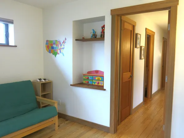 a bedroom with furniture and a window