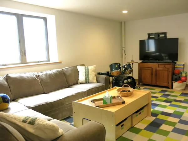 a living room with a couch and a window