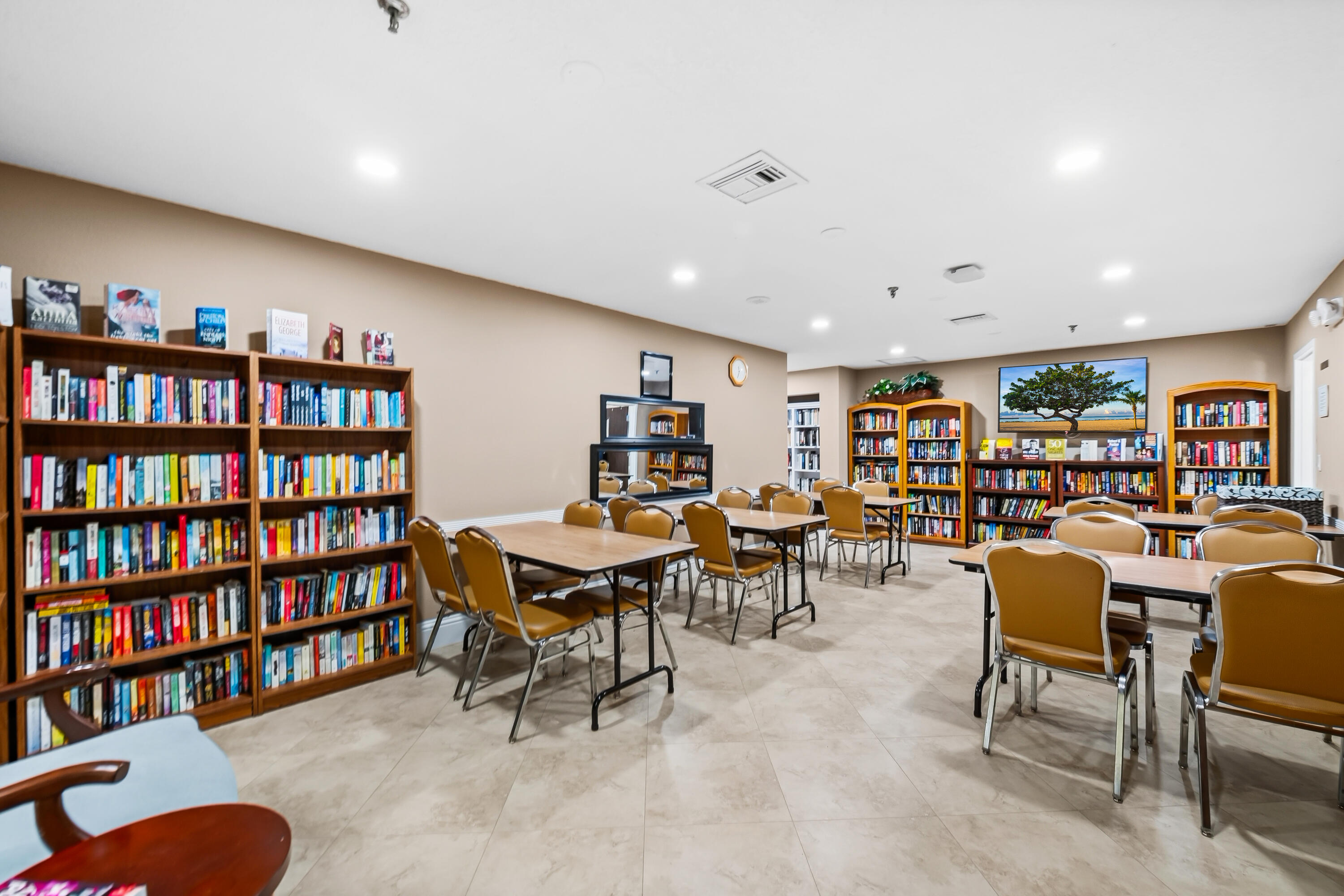 18762 Candlewick Drive Boca Raton, FL 33496 - Photo 23 of 52 a living room with furniture and a book shelf