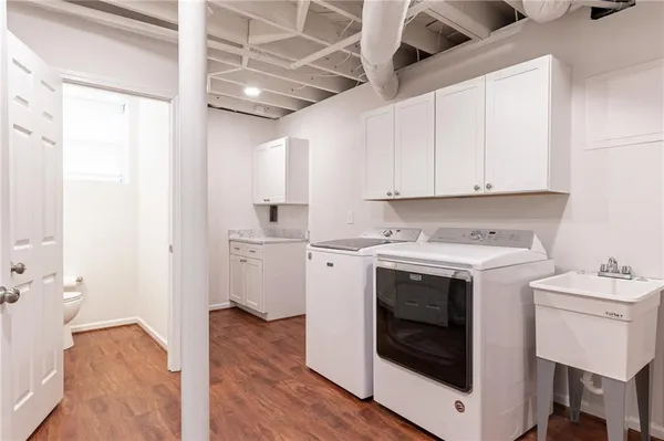 a view of a storage and utility room with washer and dryer