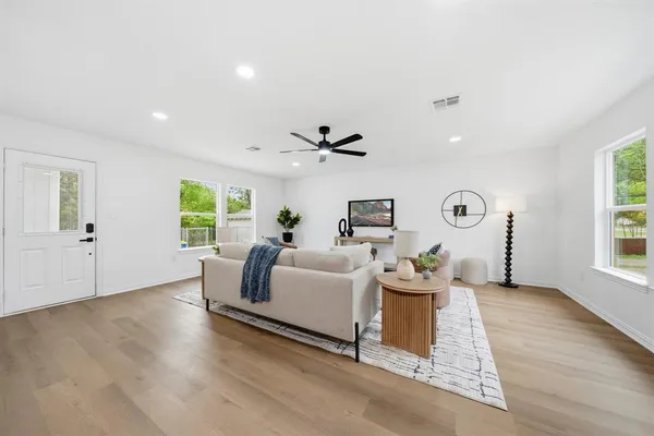 a living room with furniture and window