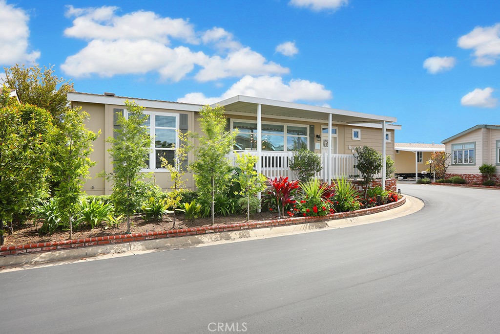155 Sereno Tustin, CA 92780 - Photo 1 of 1 a view of a house with a garden and pathway