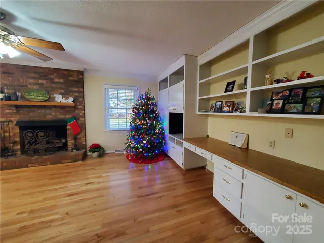 a kitchen with furniture cabinets and a fireplace