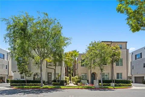 a view of a house with a palm tree