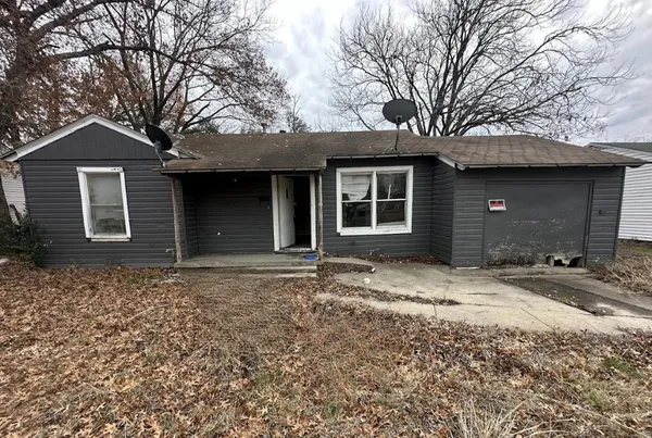 a house with trees in front of it