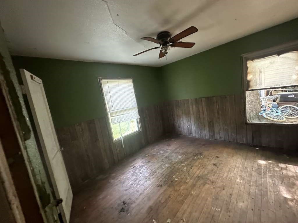 312 Mistletoe Street Marlin, TX 76661 - Photo 8 of 10 a view of empty room with ceiling fan and window