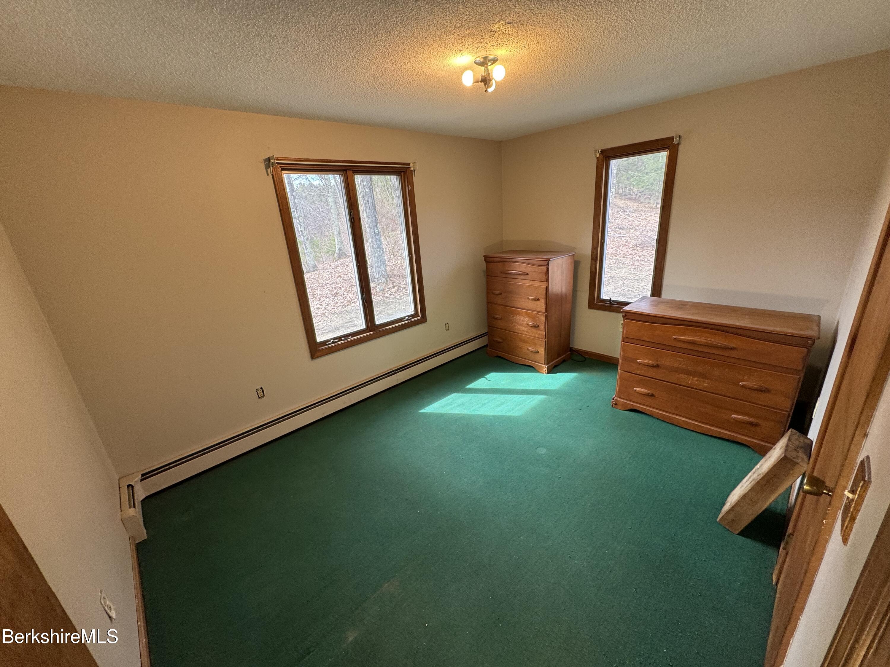44 C Mt Washington Road Egremont, MA 01230 - Photo 14 of 25 a view of an empty room with window and wooden floor