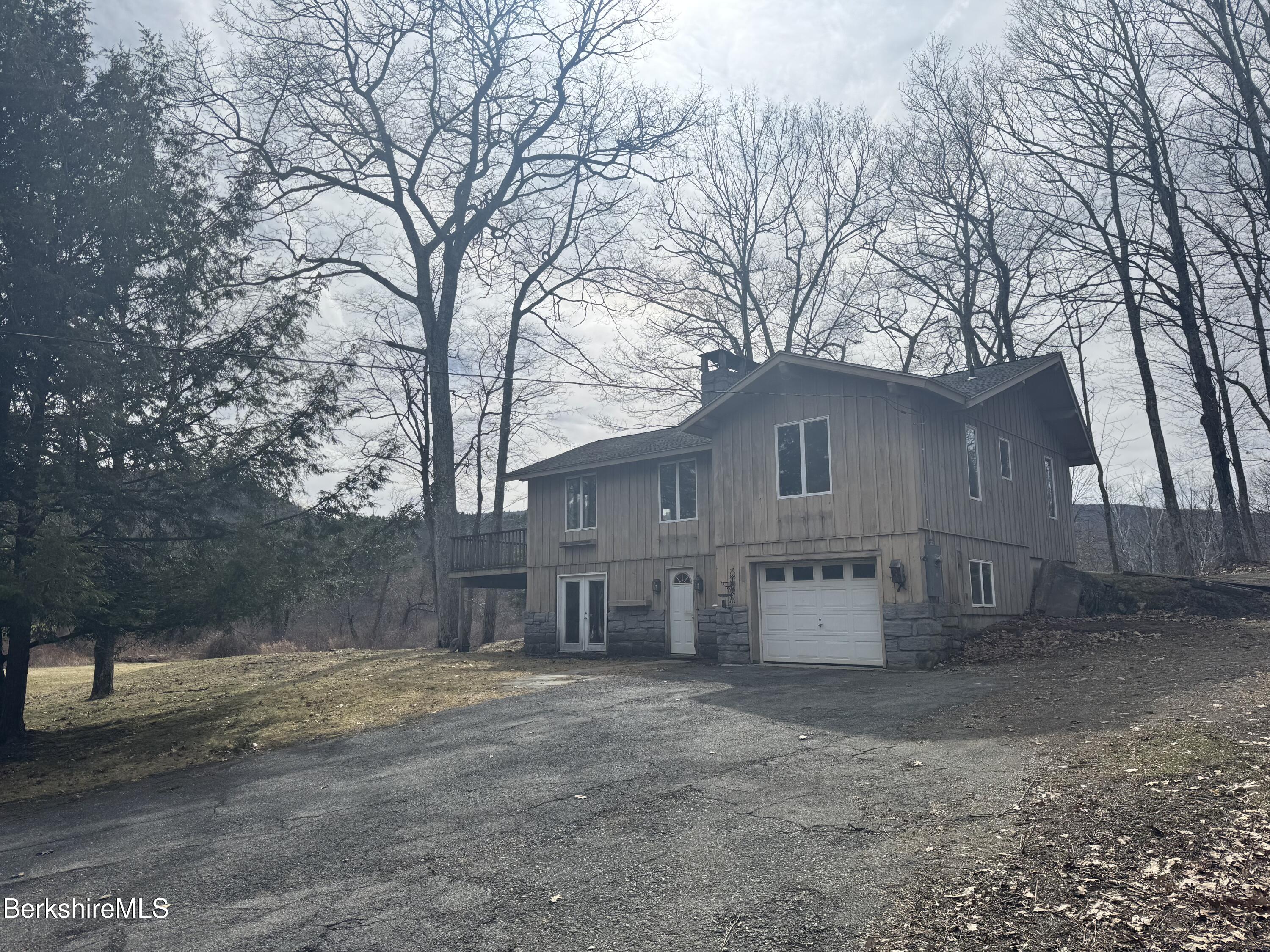 44 C Mt Washington Road Egremont, MA 01230 - Photo 2 of 25 a view of a house with a yard covered in snow
