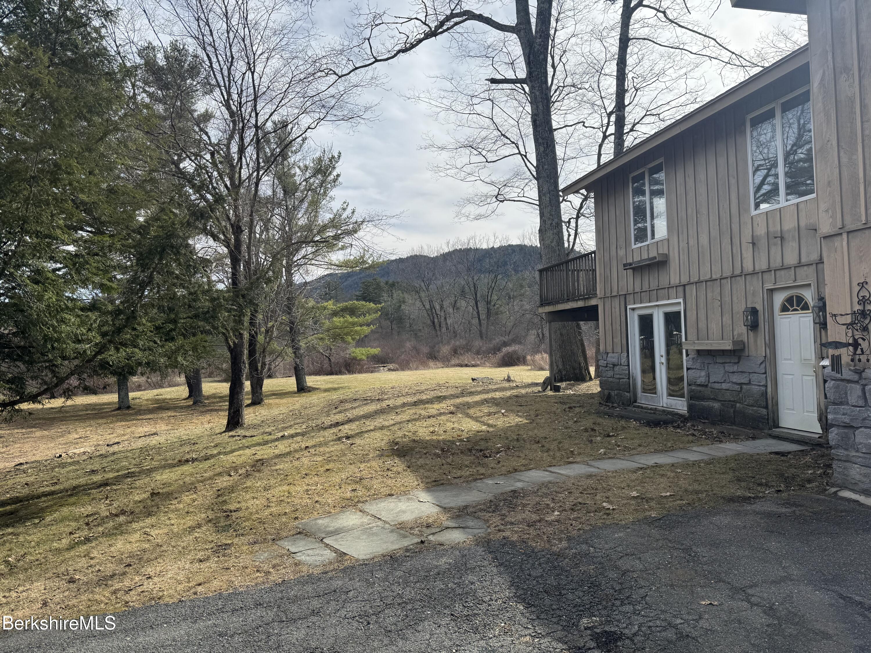 44 C Mt Washington Road Egremont, MA 01230 - Photo 3 of 25 a view of empty room with a large tree
