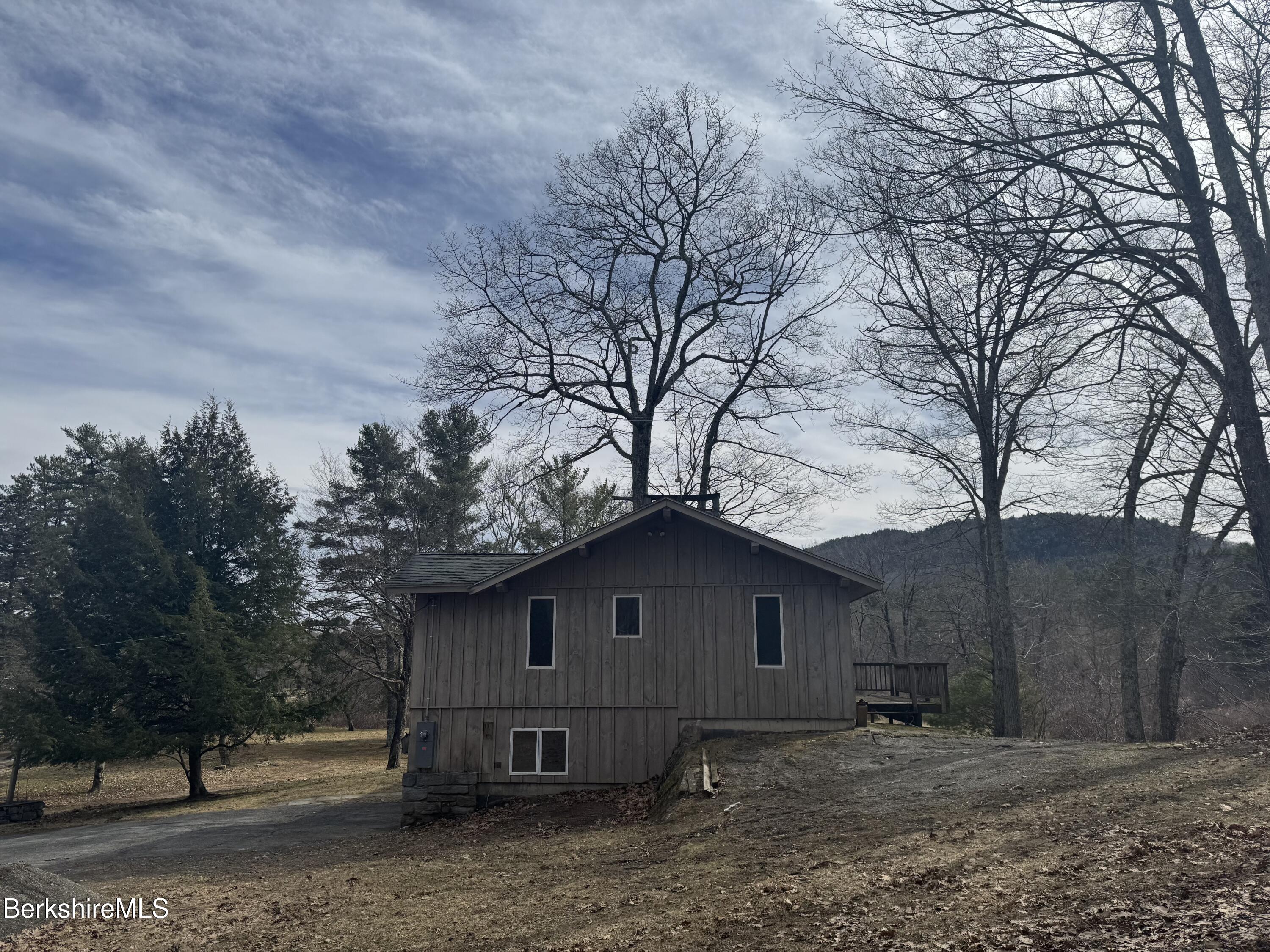 44 C Mt Washington Road Egremont, MA 01230 - Photo 5 of 25 a house view with a barn in the middle of a yard