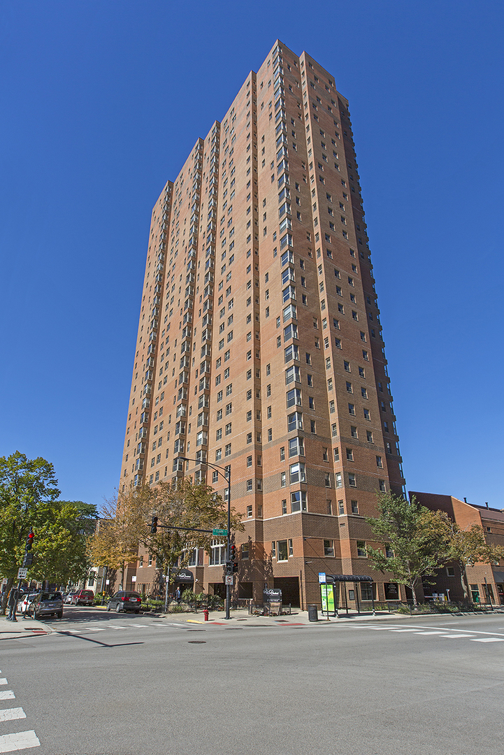 100 West Chestnut Street, Unit 1008 Chicago, IL 60610 - Photo 1 of 10 a view of a tall building next to a road
